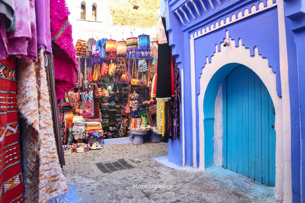 Cafe terraces and daily activity around the Chefchaouen plaza